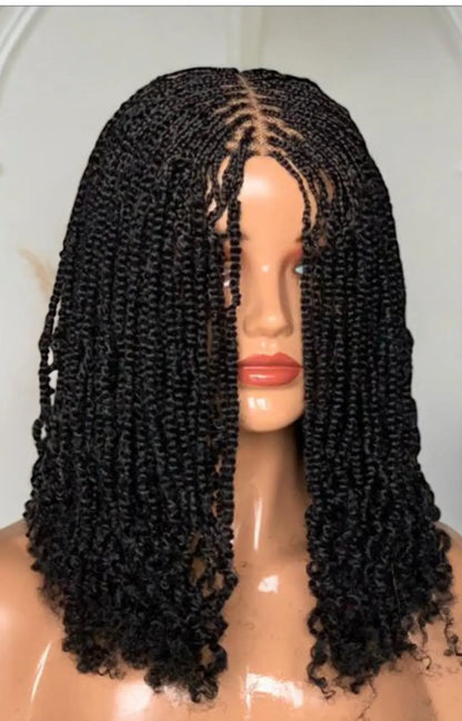 Kinky Twist hairstyle in color 1B on mannequin with shoulder-length, tight coiled braids.