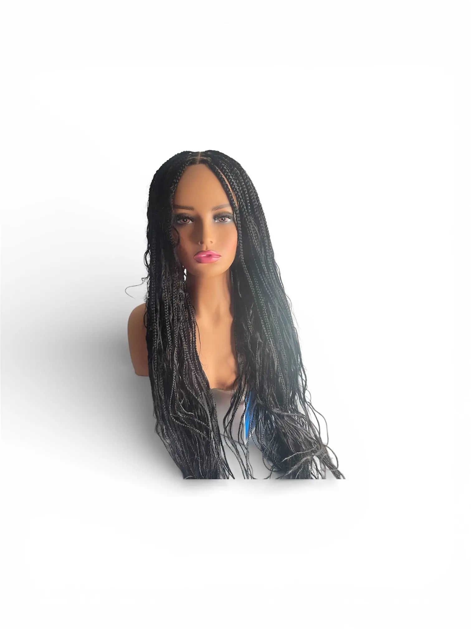 Mannequin head wearing long black boho goddess braids.